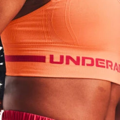 Under Armour Seamless Low Long Sport-BH Damen - Apricot, Rot